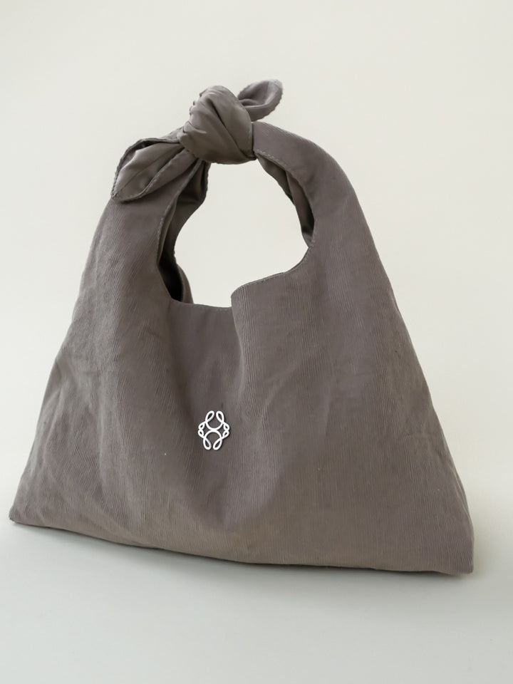 The Beige Monogram Pouch